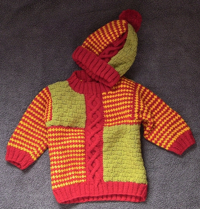 Child's brightly coloured cable Jumper and hat